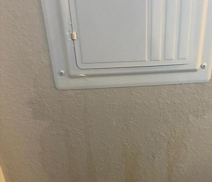 Breaker box with wall leaking with water
