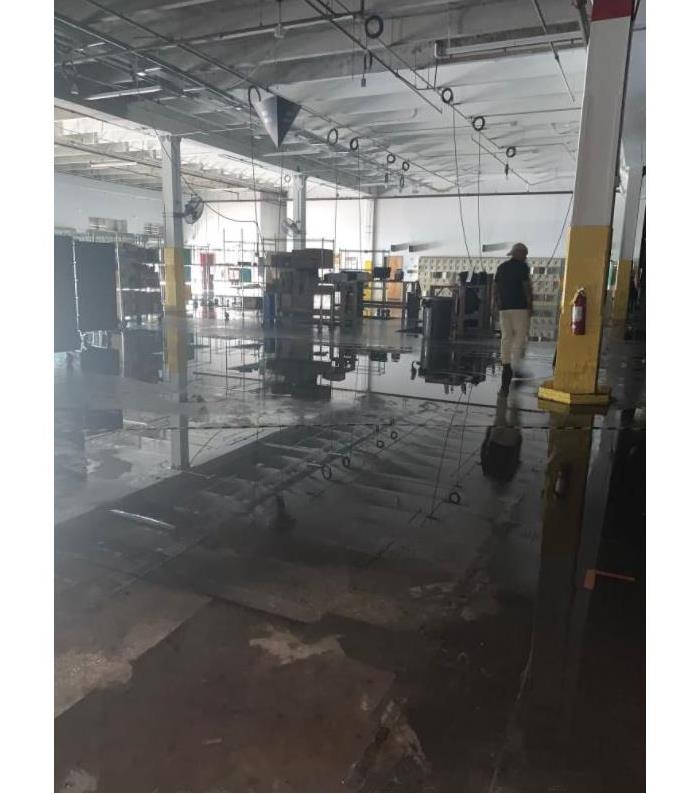 SERVPRO of West Miami Technicians reviewing water damaged commercial facility